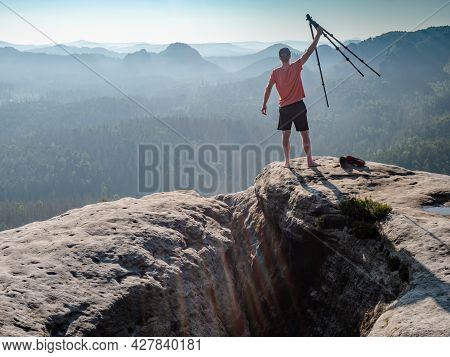 The Photographer Holds A Tripod With A Camera High In The Air And Rejoices In A Beautiful Day. Natur