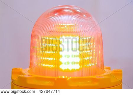 Close Up Of Orange Alarm Lamp Signal Warning Flashing Light For Industrial Machinery At Emergency, S