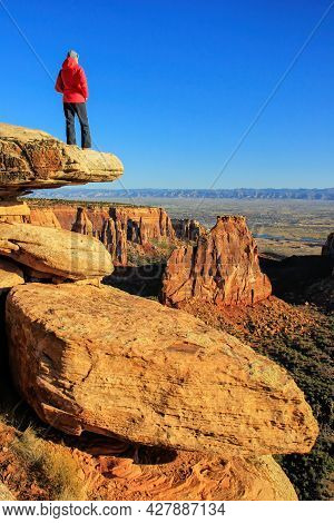 Hiker Injoying The View Of  Monument Canyon, Colorado National Monument, Grand Junction, Usa