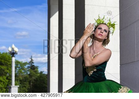 Dancing Ideas. Professional Caucasian Ballet Dancer In Green Tutu Dress Posing On Dancing Pose Outdo