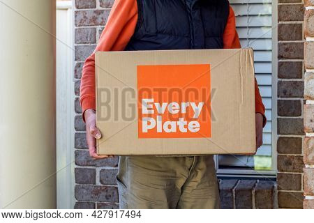 Sydney, Australia 2020-05-09 Delivery Man Holding Every Plate Meal Kits In A Box Near The Front Door