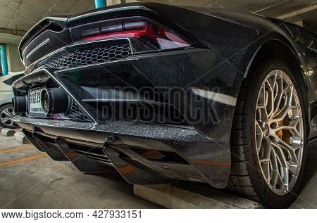 Bangkok, Thailand - 26 Jul 2021 : Rear Light Or Tail Lamp, Exhaust Pipe And Wheel Of Black Lamborghi