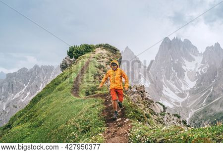 Backpacker With Backpack Enjoying The Turquoise Lago Di Sorapiss 1,925m Altitude (mountain Lake) Vie