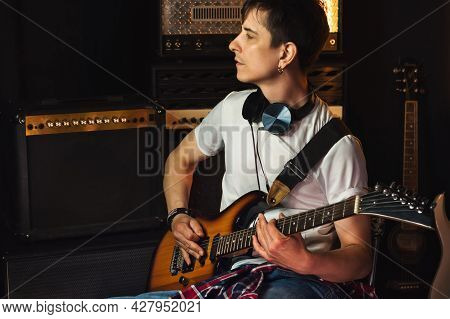 Handsome Young Male Musician With Electric Guitar In Recording Studio. Guitarist Performance. Guitar