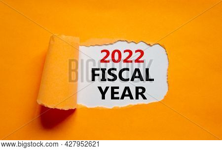 2022 Fiscal New Year Symbol. Words '2022 Fiscal Year' Appearing Behind Torn Orange Paper. Beautiful 