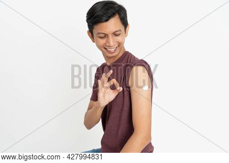 Asian Patient Getting Vaccinated Against Coronavirus By Doctor
