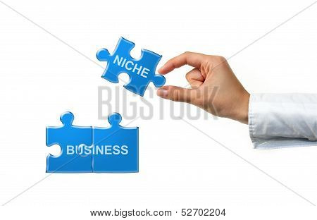 Hand with puzzle and words isolated on white