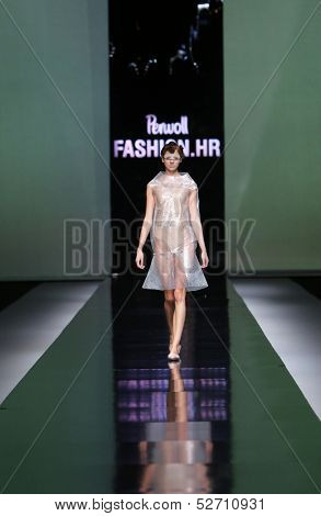 ZAGREB, CROATIA - OCTOBER 19: Fashion model wearing clothes designed by Branka Donassy on the 'Fashion.hr' show on October 19, 2013 in Zagreb, Croatia.