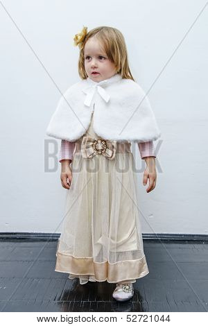 Cute Little Girl Trying On Dress