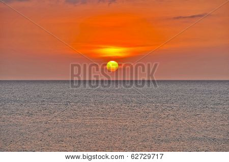 An orange Sun setting in Cuba