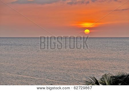 An orange Sun setting in Cuba