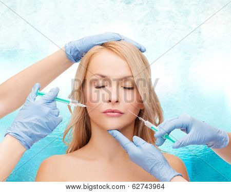 beauty and cosmetic surgery concept - woman with closed eyes and beautician hands with syringes
