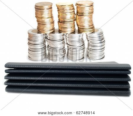 Family Travel Saving Concept With Pile Of Passports And Coins