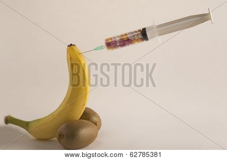 Male Impotence Metaphor: Banana,kiwi And Syringe With Pills