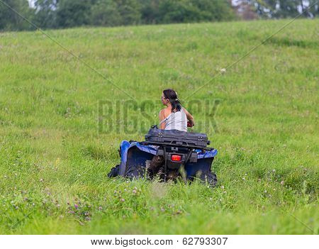 Elegant Woman Riding Extreme Quadrocycle
