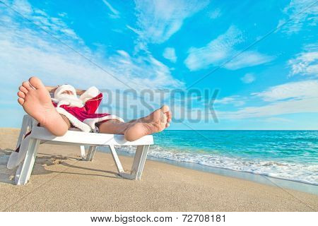 Sunbathing Santa Claus Relaxing In Bedstone On Beach - Christmas