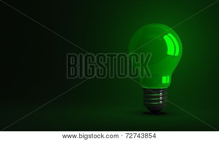 green Glowing Light Bulb On Dark Background