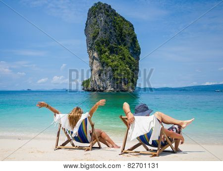 Couple of tourists on the beach in Thailand