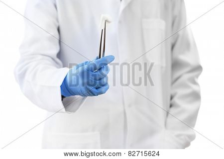 Doctor holding metal forceps with cheesecloth isolated on white background