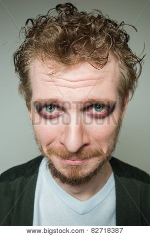 prortret guilty of a bearded man with makeup.