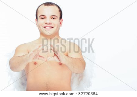 Little angel with white wings posing