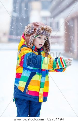 Little Boy Playing With Snow In Winter, Outdoors.