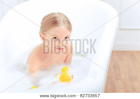 Cute little girl in the bathroom
