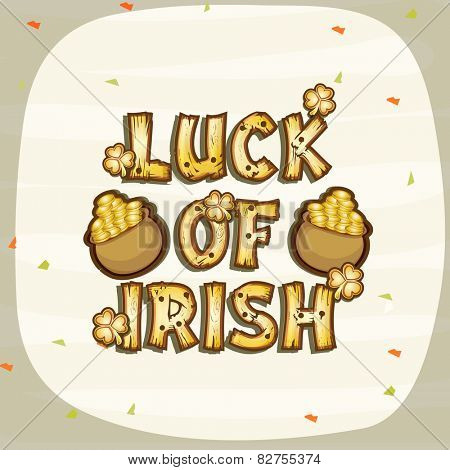 Happy St. Patrick's Day celebration with wooden text Luck of Irish, shamrock leaves and gold coin earthenware on stylish background.