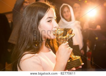 BERLIN, GERMANY - FEBRUARY 14: Solmaz Panahi, Niece of Jafar Panahi with golden bear for 'Taxi'. Closing Ceremony. 65th Berlinale at Berlinale Palace on February 14, 2015 in Berlin, Germany.