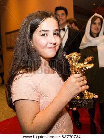BERLIN, GERMANY - FEBRUARY 14: Solmaz Panahi, Niece of Jafar Panahi with golden bear for 'Taxi'. Closing Ceremony. 65th Berlinale at Berlinale Palace on February 14, 2015 in Berlin, Germany.