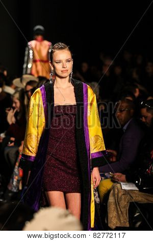 NEW YORK - FEBRUARY 13: A model walks the runway at the Mongol Fall/Winter 2015 collection during Mercedes-Benz Fashion Week in New York on February 13, 2015.