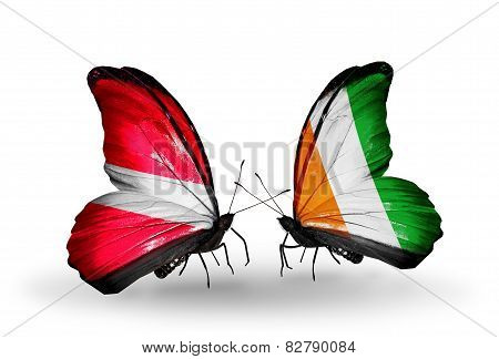 Two Butterflies With Flags On Wings As Symbol Of Relations Latvia And  Cote Divoire