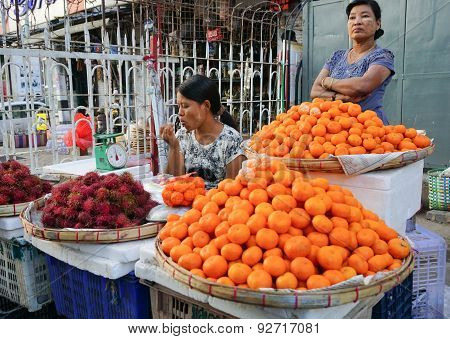 Burmese Women Selling Fresh Fruits At Bogyoke Market
