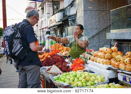 Burmese Women Selling Fresh Fruits At Bogyoke Market
