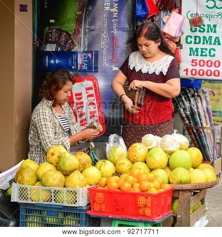 Burmese Women Selling Fresh Fruits At Bogyoke Market
