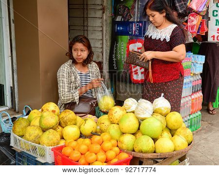 Burmese Women Selling Fresh Fruits At Bogyoke Market