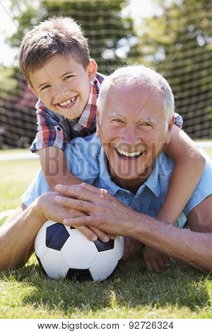 Portrait Of Grandfather And Grandson With Football