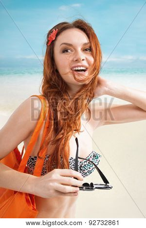 Redhair woman on beach