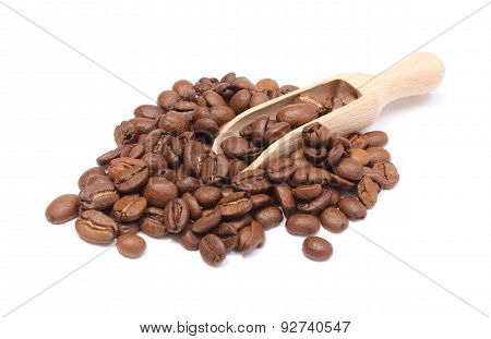 Heap Of Coffee On Wooden Spoon. White Background