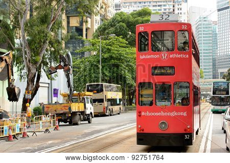 HONG KONG - JUNE 03, 2015: double-decker tram on street of HK. Hong Kong Tramways is a tram system in Hong Kong, being one of the earliest forms of public transport in the metropolis