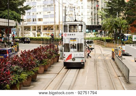HONG KONG - JUNE 03, 2015: double-decker tram on street of HK. Hong Kong Tramways is a tram system in Hong Kong, being one of the earliest forms of public transport in the metropolis.