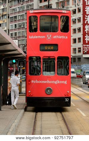 HONG KONG - JUNE 03, 2015: double-decker tram on street of HK. Hong Kong Tramways is a tram system in Hong Kong, being one of the earliest forms of public transport in the metropolis.