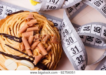 Cupcake With Measuring Tape On Table