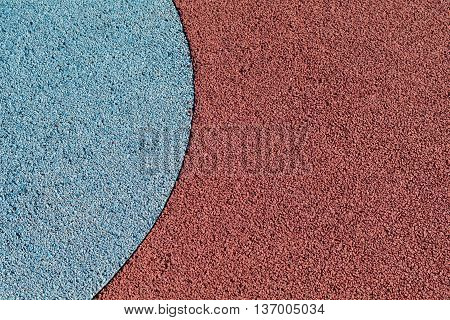 Rubber play ground floor surface covering colorful blue and red curved shapes