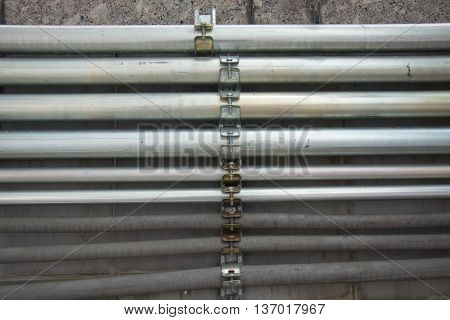 Row of cable conduit installed on the wall