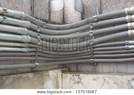 Row of cable conduit installed on the wall