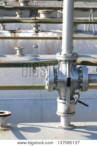 Ball Valve Above The Huge Gas Cylinder In The Industrial Refiner