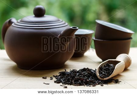 Black Tea, Teapot And Cups On The Table