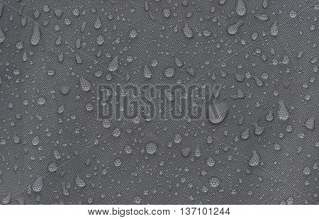 Rainproof tent sheet with rain drops. macro shot