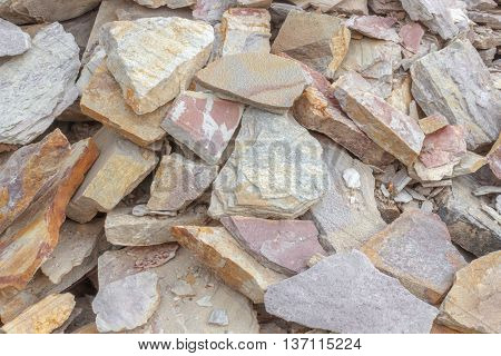 A big heap of sandstones storage space of various natural sandstone